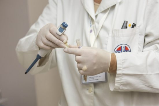 medical staff in hospital laboratory perform tests